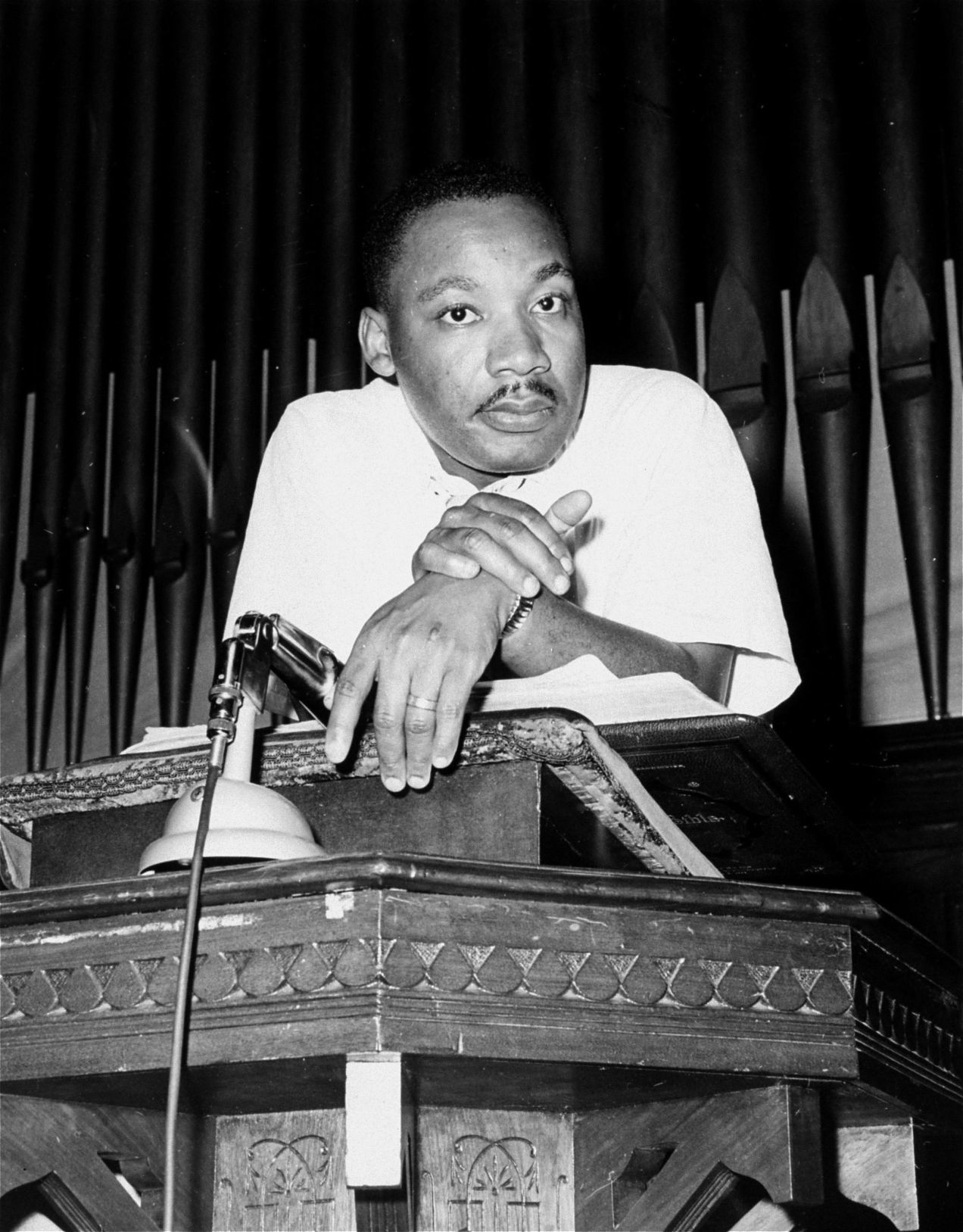Martin Luther King Jr. leaning on lecturn